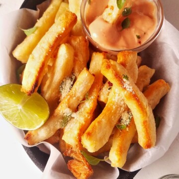 yuca fries dipped in sauce