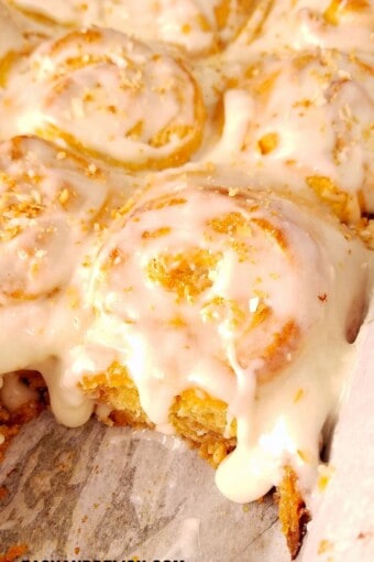 coconut rolls with coconut frosting dripping