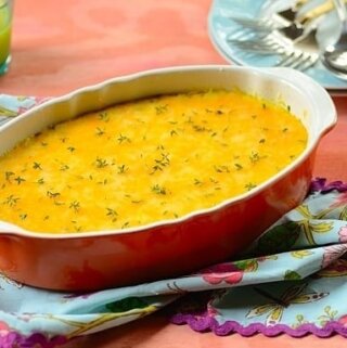 Brazilian tamale casserole in a red dish