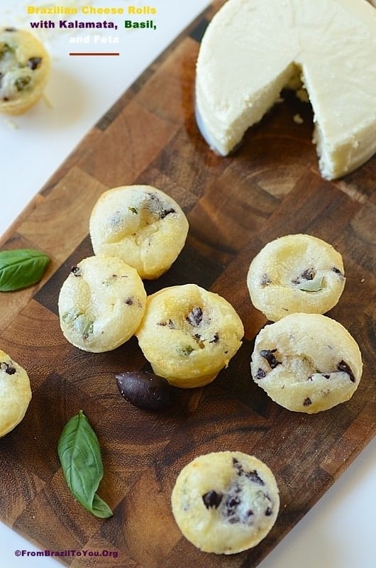 Gluten-Free Dinner Rolls with Kalamata, Basil, and Feta on a cutting board