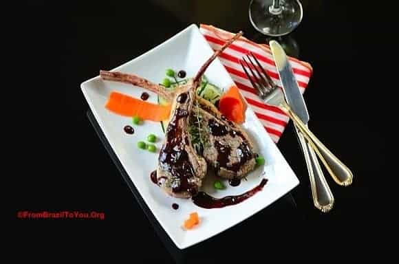 A plate of lamb chops with garnishes