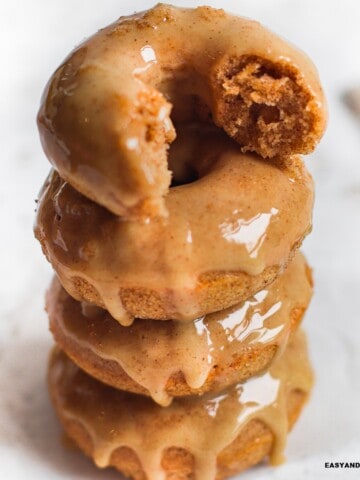 a pile of apple cider baked donuts.