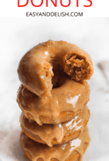close up of a pile of baked donuts glazed on top