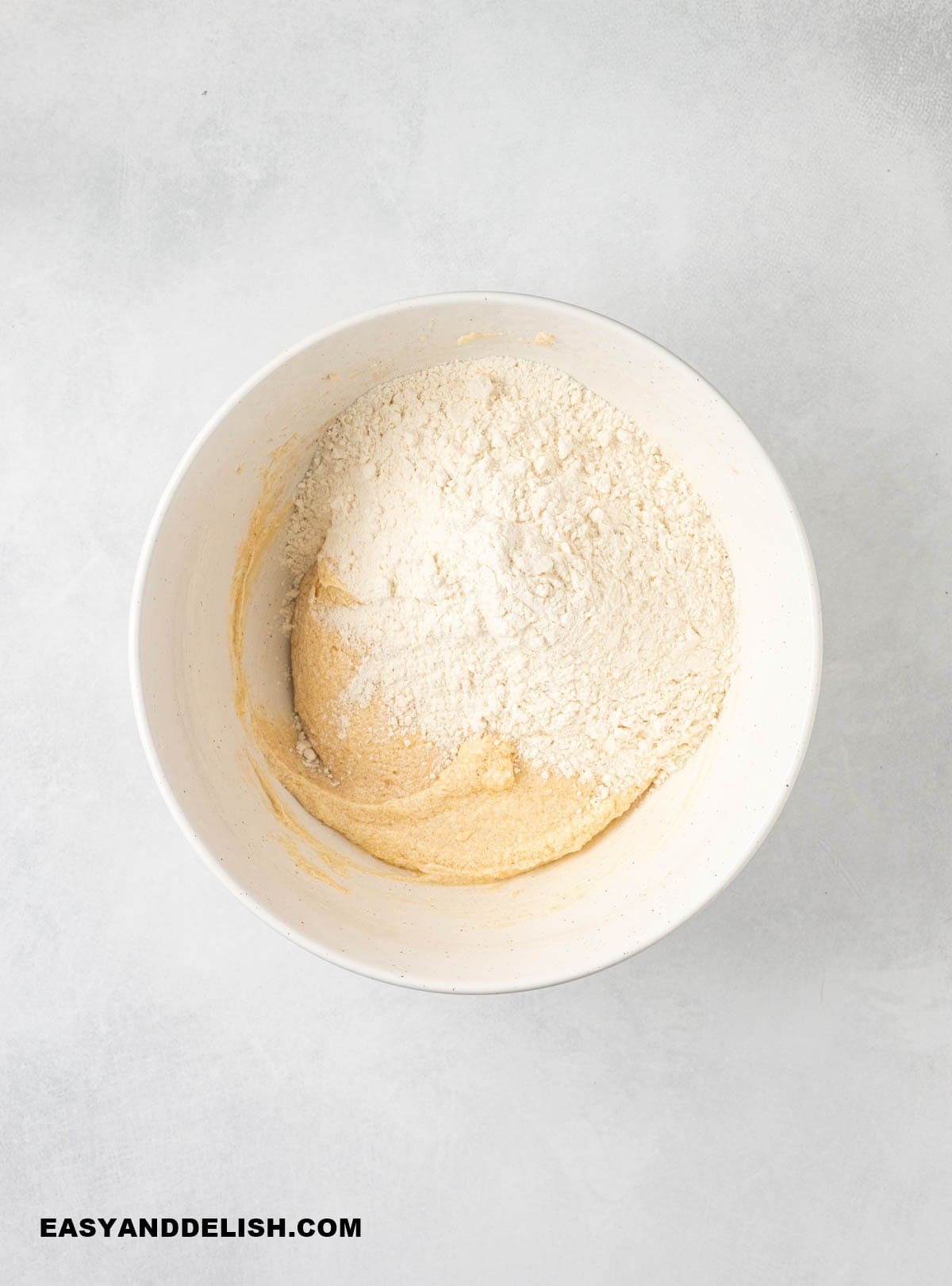 flour mixed into the batter in a bowl.