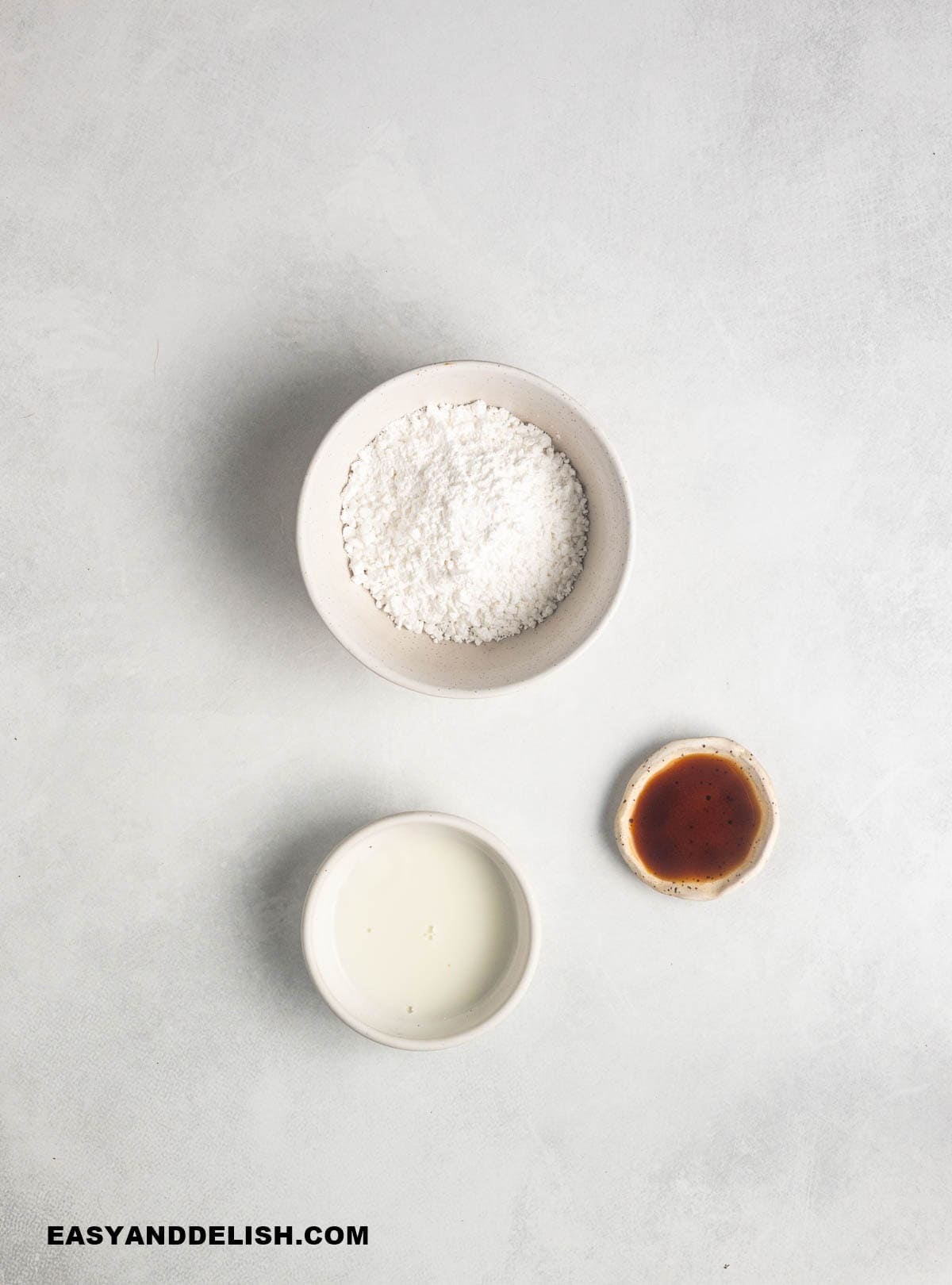 ingredients for the vanilla glaze on a table.