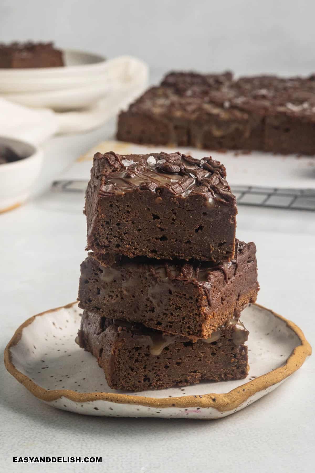 a pile of healthy sweet potato brownies in a plate. 