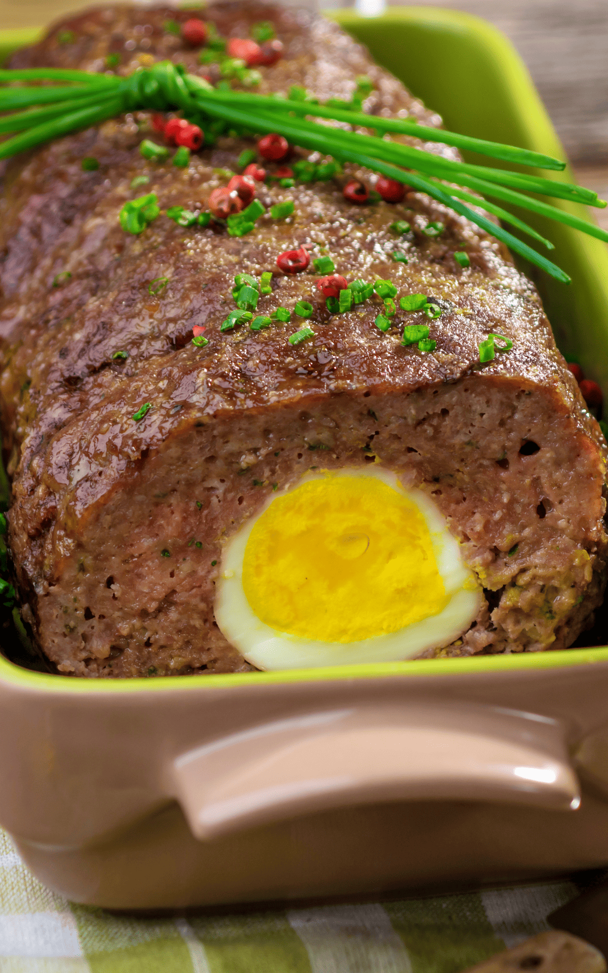 meatloaf with boiled egg ina frontal close up.