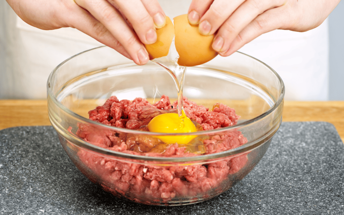 ground beef and egg in a bowl.
