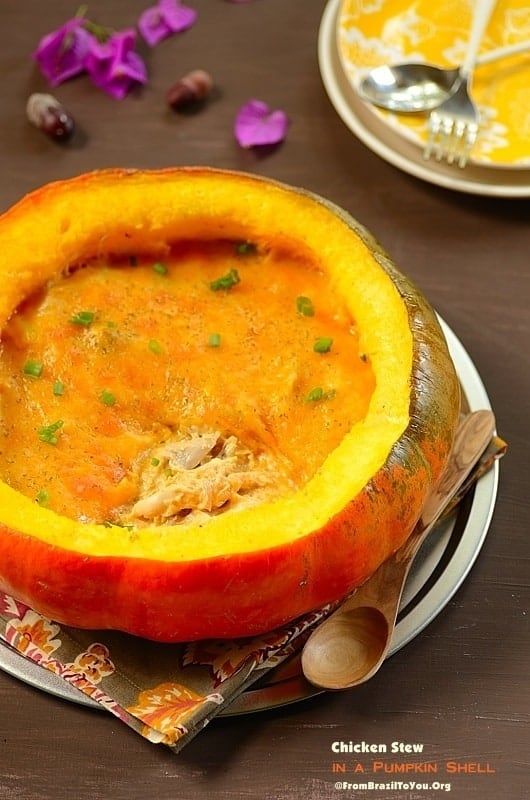 Chicken Stew in a Pumpkin Shell (Frango na Moranga) with spoon on the side