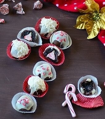 no bake chocolate candy cane cheesecake cookies in truffle wrappers