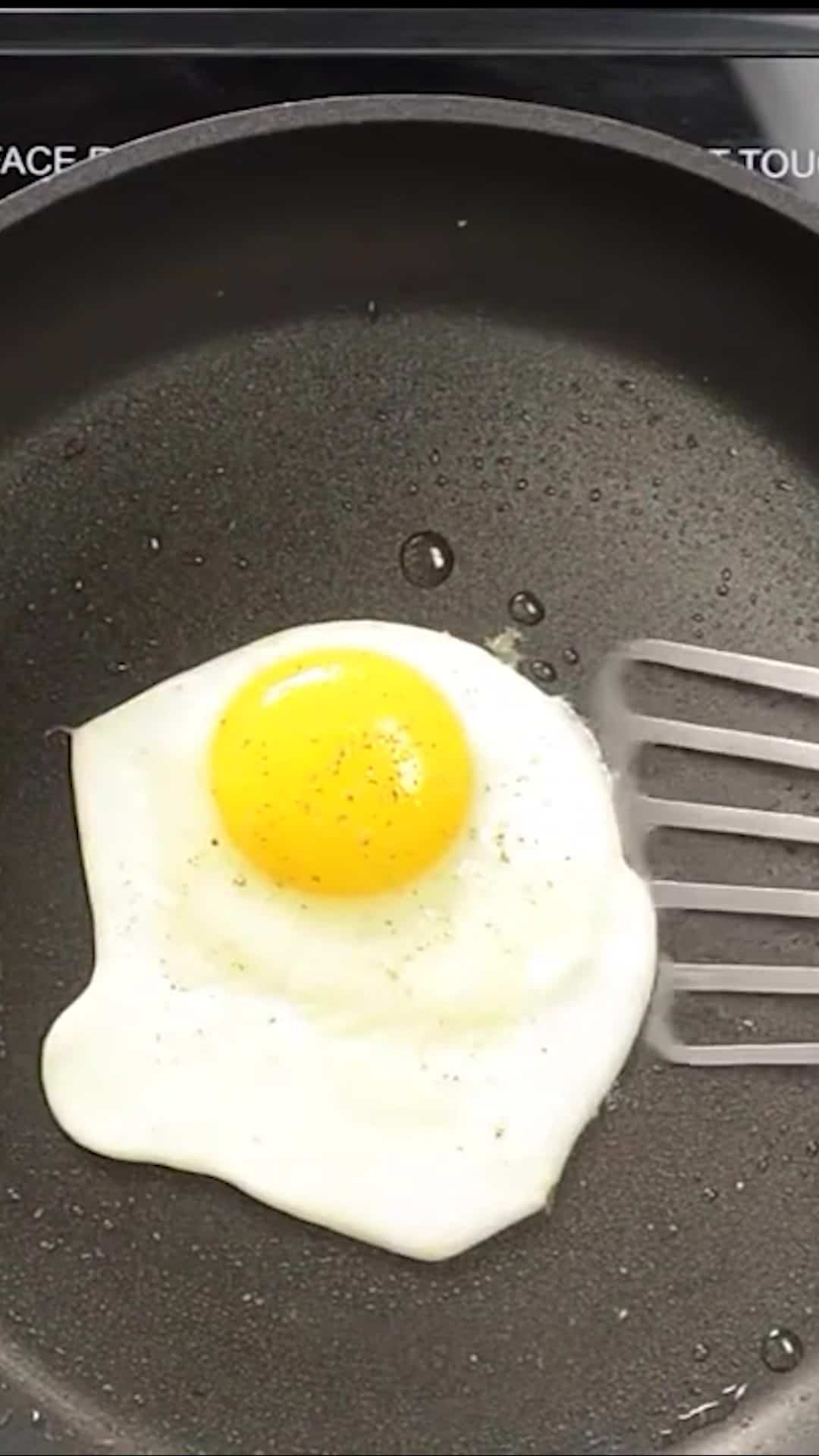 Cooked egg in a slillet.