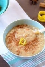 A bowl of rice pudding on a table