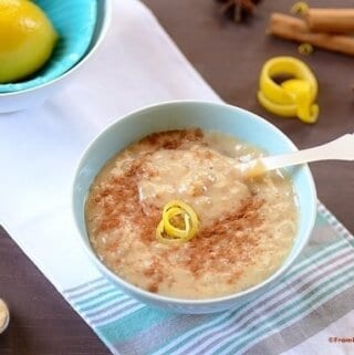 A bowl of rice pudding on a table