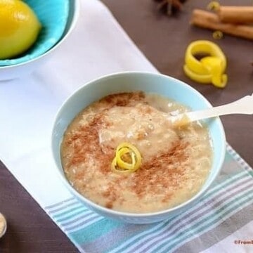 A bowl of rice pudding on a table