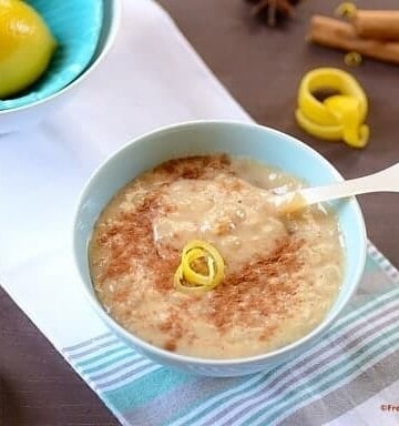 A bowl of rice pudding on a table