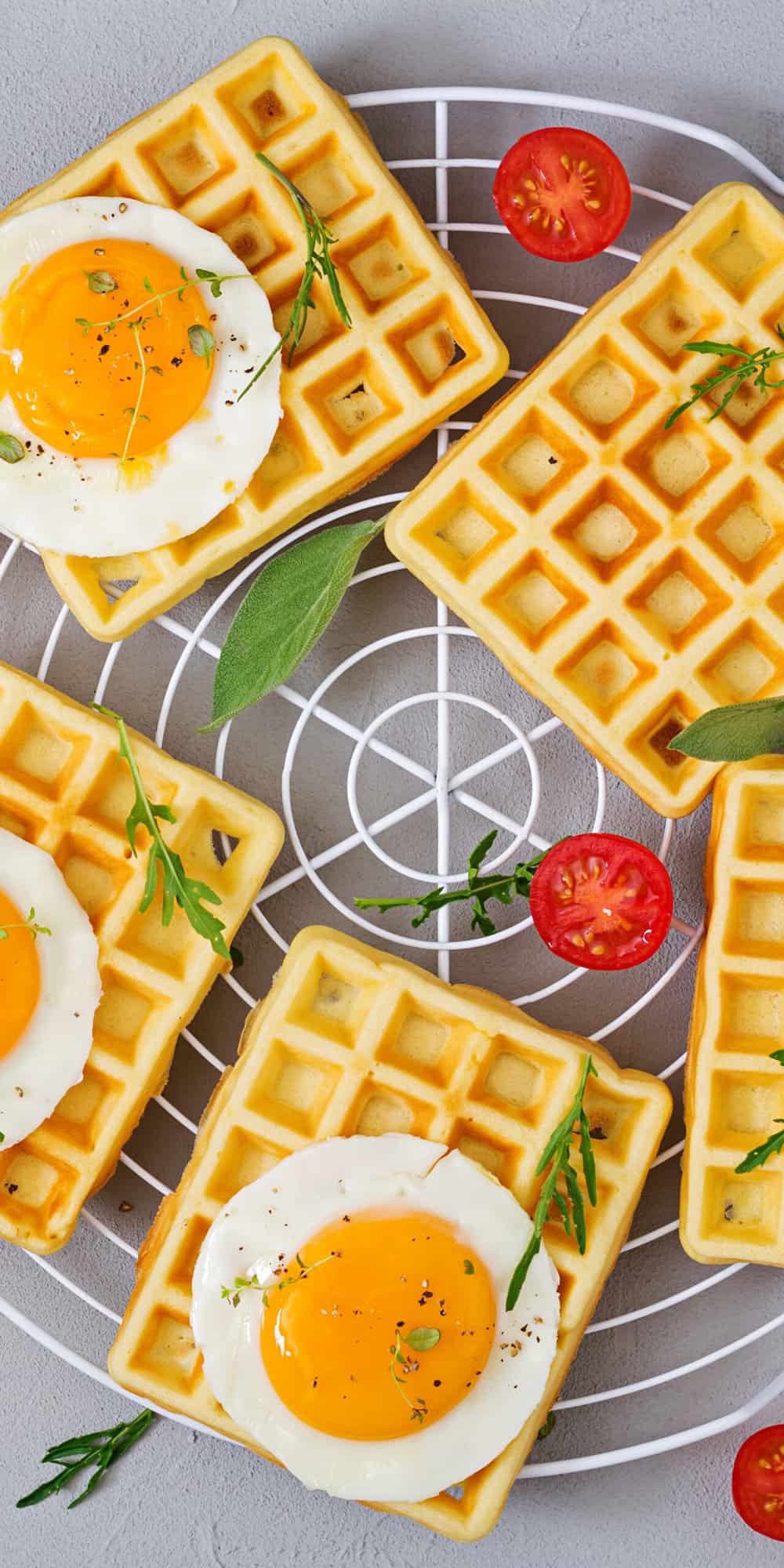 gluten-free waffles served with healthy breakfast sides such as fresh herbs and eggs