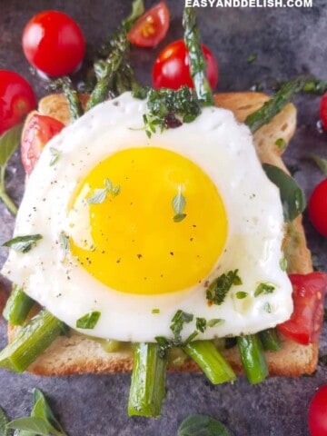 Close up of sunny-side up eggs on a toast.