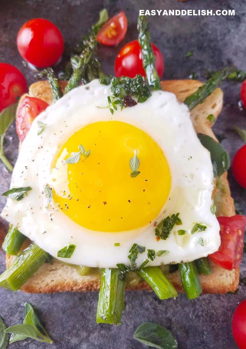 Close up of sunny-side up eggs on a toast.