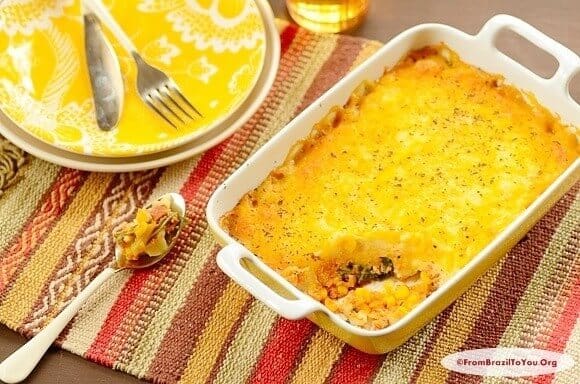 Casserole dish of escondidinho de frango, a type of chicken shepherd's pie with yuca