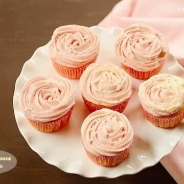 Several Passion Fruit Mousse Cupcakes on a frilled serving dish