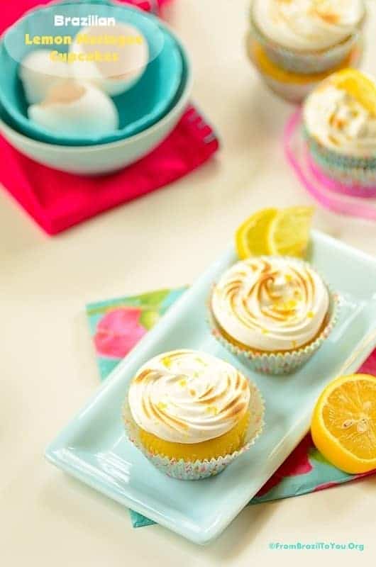 Two Brazilian lemon meringue cupcakes on a dish
