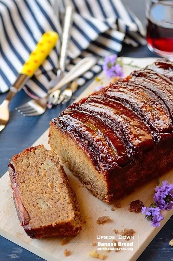 old image of baked good, part whole and part sliced served on a platter