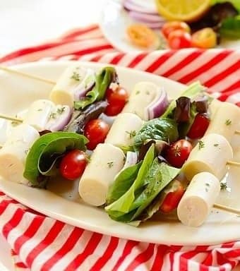 Hearts of palm and tomatoes and lettuce on kabob skewers