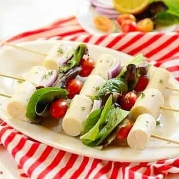 Hearts of palm and tomatoes and lettuce on kabob skewers