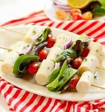 Hearts of palm and tomatoes and lettuce on kabob skewers