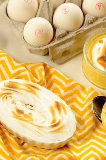 passion fruit pies on a table with a bow of eggs on the background