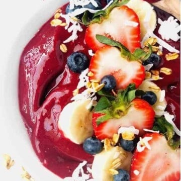 close up of acai bowl topped with fresh fruits