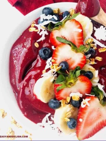 close up of acai bowl topped with fresh fruits