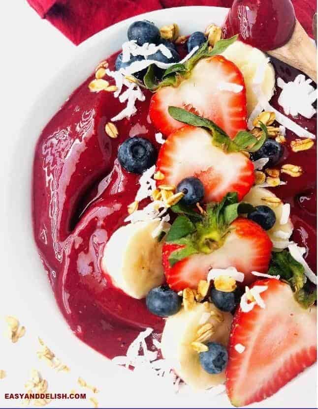 close up of acai bowl topped with fresh fruits