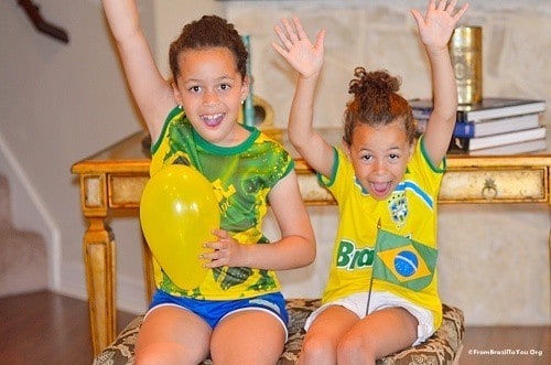 two girls cheering for their soccer team