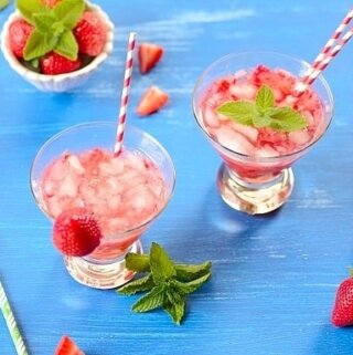 glasses of strawberry caipirinha cocktail