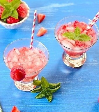 glasses of strawberry caipirinha cocktail