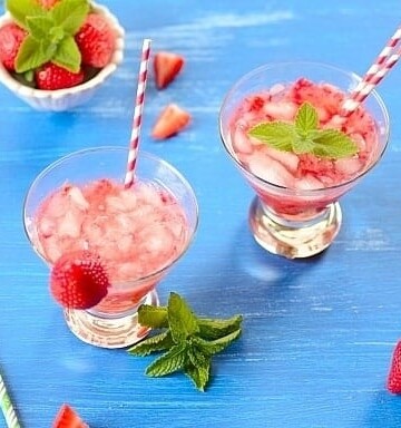 glasses of strawberry caipirinha cocktail