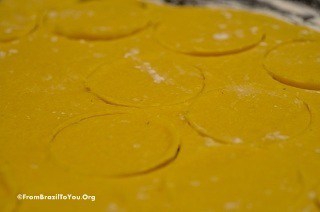 coxinha dough which has been rolled out flat and cut into round discs