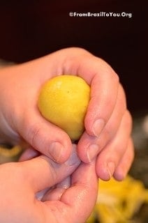 Forming the neck of the coxinha with two hands