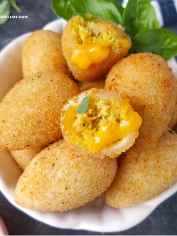 close up of coxinha (Brazilian chicken croquettes) in a bowl.