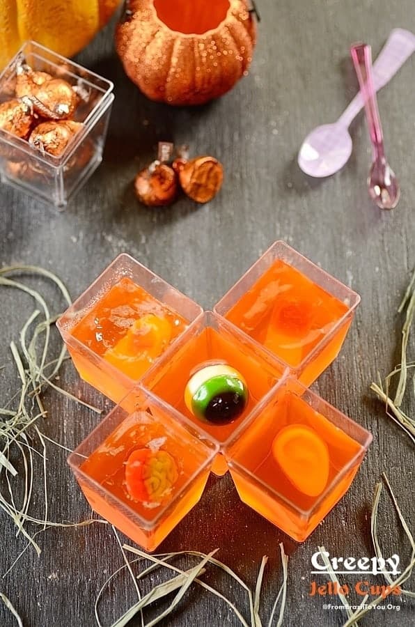 Creepy Jello Cups with mini spoons and candies on the side