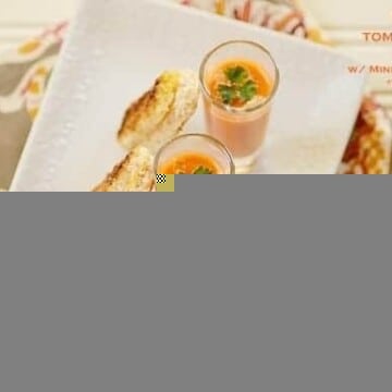 Three glasses of tomato soup with bread slices