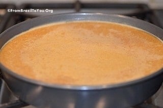 flan in a round metal plan after it has been baked