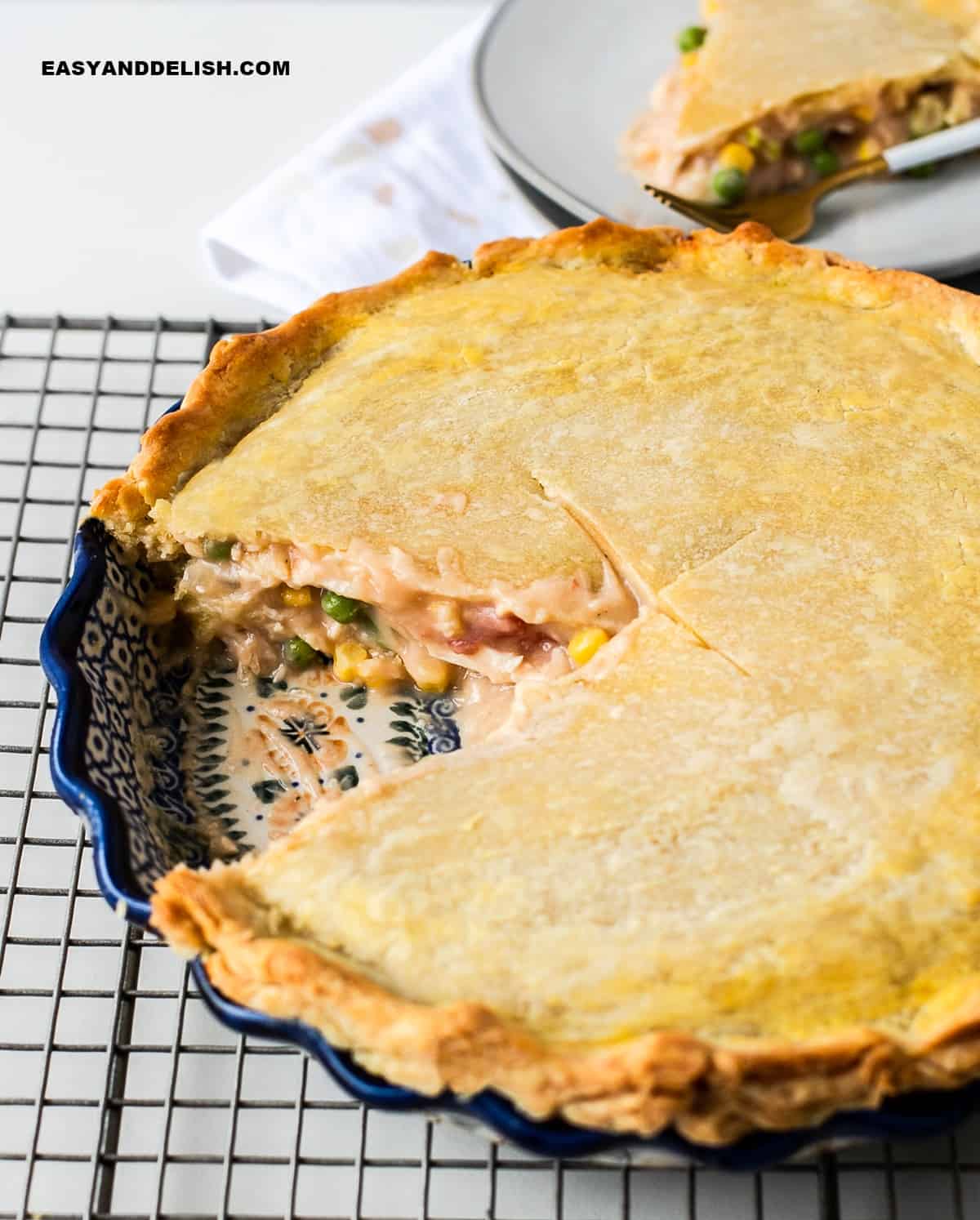 a slice of the homemade chicken pot pie taken away showing the creamy filling