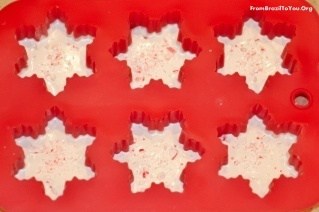white candy melts molded into a snowflake shape