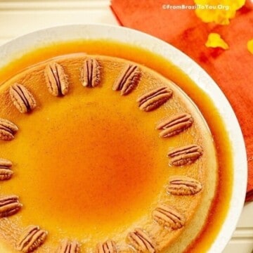 Flat lay photo of a pumpkin flan on a white plate