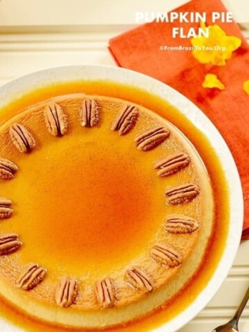 Flat lay photo of a pumpkin flan on a white plate