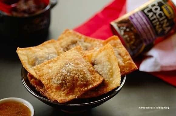A close up of feijoada empanadas in a bowl