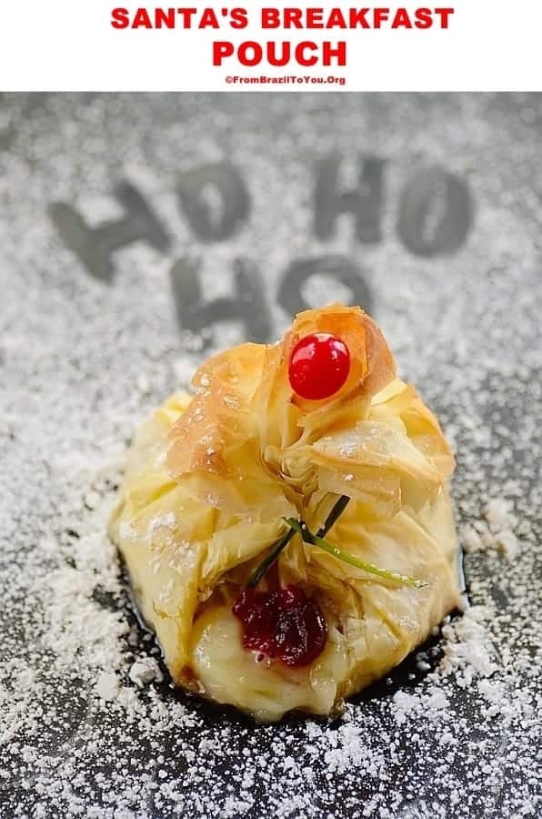 A close up of a puff pastry topped with a red cherry