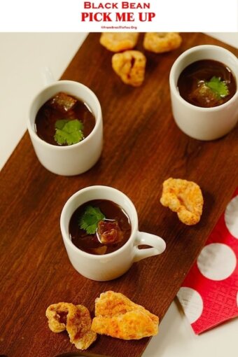 mini cups with bean broth on a platter